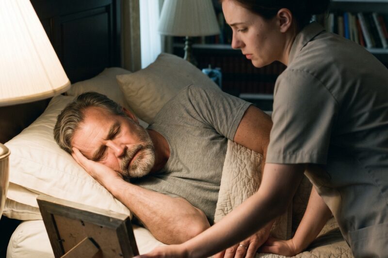 I HELD HIS PULSE WHILE HE PRETENDED TO SLEEP. I SAW THE GAPS WHERE GRIEF HAD BEEN HIDING. I KNEW THE HOUSE WAS HELL FOR EVERYONE BUT HIM.  The library was dark except for the rain sliding down the tall windows, casting streaks across the marble floors. I held the coffee tray in both hands, pretending the weight was heavier than it actually was. My fingers trembled slightly—not from fear, but from knowing I was the only person in the mansion who could see what no one else dared to notice.  Rodrigo Cárdenas lay on the sofa, motionless. Dark suit, jacket draped on the chair, cufflinks sparkling innocently in the dim light. Luxury everywhere, but no warmth. Not a single laugh. Not a single sound that suggested anyone in this house had ever been truly alive.  I knelt beside him and checked his pulse.  His eyes snapped open, sharp and accusing.  “What are you doing?”  “Checking whether you are acting… or dying,” I said, my voice steady despite my heart hammering.  For a second, his face froze. Then the tension in his jaw loosened ever so slightly.  I picked up the service phone and called for medical assistance. Mrs. Herrera arrived first, her face taut with the authority that made every staff member tremble. Then the private doctor. He tried to dismiss them. His pulse betrayed him. His chest betrayed him.  I didn’t step back.  I had cleaned bloodied pillows for my grandmother, held her upright through nights she refused a doctor, watched her fade from pride and stubbornness alone. I was not letting a billionaire die in silence because of ego.  He wanted control. I wanted honesty.  “You knew I was pretending,” he said after the doctor left, voice low, almost unreadable.  “Yes,” I admitted.  “And you still called help?”  “Because whether or not you trust me is your problem. Whether you were breathing properly became mine.”  His eyes softened in that moment. Something cracked behind the polished walls he had built around himself. Not a smile. Not relief. Just the first trace of someone remembering he could exist without pretending.  That night, the envelope, the watch, the velvet box—they were gone. The trap he had set vanished.  But the mansion began to breathe again. Not through money. Not through power. Through small things. A child’s cup on the kitchen shelf. Fingerprints on the sunroom glass. A yellow door painted on a little wooden playhouse tucked in the greenhouse.  I cleaned it. Not fully. Not to erase the past. Just enough so it could stand. A small pot of marigolds at the door.  The next morning, Rodrigo found it. His face paled, his hands clenched the roof of the playhouse like it was the only solid thing left.  “I forgot the room had morning light,” he whispered.  “Rooms remember things we don’t,” I said.  For weeks, I watched the mansion come back to life through soup, opened curtains, and quiet care. Rodrigo spoke more. Small fragments at first. Then he asked about my nursing studies. He brought me textbooks, quietly, no ceremony. He began to let me make choices.  And then Mariana Luján arrived—a smile too polished, a presence that carried old ambitions and old whispers of social power. She walked in as if the house belonged to her, glanced at Sofía’s framed photo, and said, “Reopening tombs now?”  Rodrigo didn’t defend me. Not yet.  I only watched as the air in the mansion shifted.  A man pretending to be asleep. A woman who refused to leave him in danger. A daughter’s memory trapped in a locked room.  I carried the marigolds back into the library the next morning, remembering the first test. The envelope. The watch. The velvet box.  Rodrigo thought he was testing me.  But I was testing whether he was still alive.  And that was when I realized the mansion—and all its cold marble, all its secrets, all its wealth—was never the real house. The real house had always been hidden in what we chose to notice…  I set the marigolds on the little wooden playhouse.  And then he said something that made me stop, because it sounded like both a warning and a promise:  “I never asked for this… and yet, you still came.”  I looked at him.  And I knew the next move could change everything, but even I wasn’t ready for what that night would finally reveal…